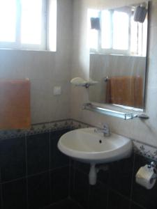 Koupelna v ubytování Cesar Guest Rooms + 10 fotografií