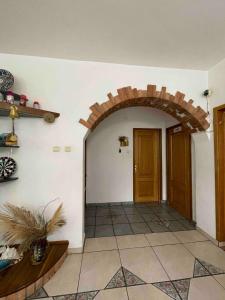 a room with an archway and a door in a house at Celesta Trei Brazi in Predeal +179 photos