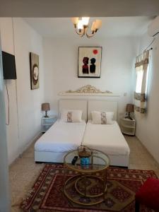 A bed or beds in a room at Casa Zitouna - Guest House - Kef, Tunisia