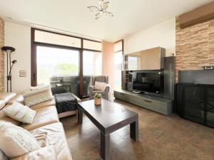 a living room with a couch and a coffee table at CASA VISTA SIERRA in Jaraiz de la Vera