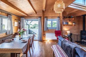 a living room with a table and a couch at The Cabin, Parham in Woodbridge