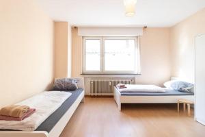 Un ou plusieurs lits dans un hébergement de l'établissement Monteurwohnung im schönen Essenheim bei Mainz