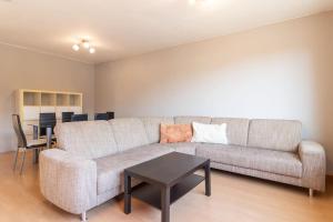 a living room with a couch and a table at Monteurwohnung im schönen Essenheim bei Mainz in Essenheim