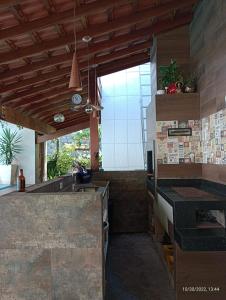 a kitchen with a sink and a counter top at Recanto Monte Alegre in Praia Grande