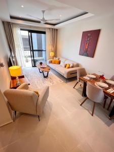 a living room with a couch and a table at Fajara Residence in Fajara