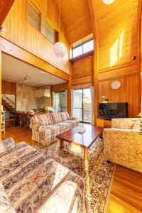 a large living room with couches and a table at Nagashima cottage - Vacation STAY 9014 in Kuwana