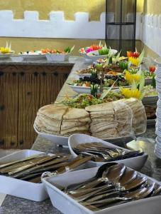 a buffet with many plates of food on a table at Mishari Wadi Rum camp in Disah