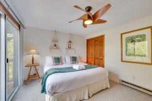 a bedroom with a bed and a ceiling fan at Mountain-View Jackson Hideaway with Deck! in Jackson