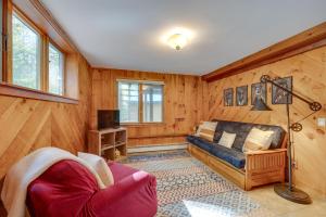 a living room with a couch and a tv at Mountain-View Jackson Hideaway with Deck! in Jackson