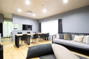 a living room with a couch and a table at Samp,Inn - Vacation STAY 27372v in Fukuoka