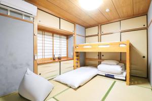 a small room with two bunk beds in it at Samp,Inn - Vacation STAY 27372v in Fukuoka