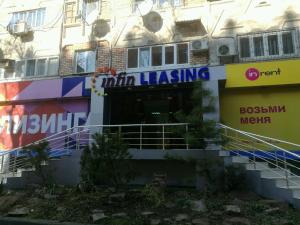 a building with a sign on the side of it at CHEKHOV APARTMENT in Tashkent