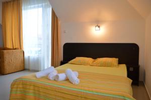 Postel nebo postele na pokoji v ubytování Hotel Paradise