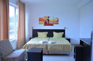Postel nebo postele na pokoji v ubytování Hotel Paradise