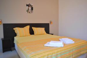 Postel nebo postele na pokoji v ubytování Hotel Paradise