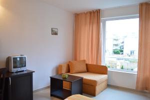 TV a/nebo společenská místnost v ubytování Hotel Paradise