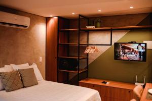 Et tv og/eller underholdning på Loft com vista para o Parque Una