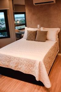 En eller flere senge i et værelse på Loft com vista para o Parque Una