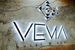 a sign for the new wyn logo on a table at Hotel Vema in Visoko