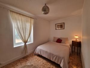 Een bed of bedden in een kamer bij Casa Sarra 52b route de lyon
