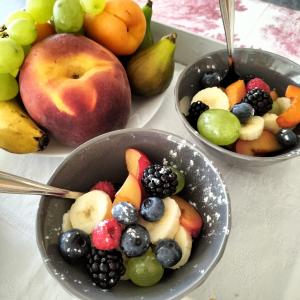 three bowls of fruit on a table with apples and pears at Stella d'Italia in Sparone