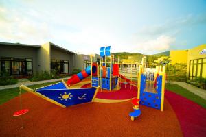 a childrens playground with a slide at Hangouts Urban+Eco Langkawi in Kuah