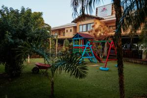 a playground in the yard of a building with at Partner Itapoa by Marina in Itapoa