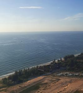 an aerial view of a beach and the ocean at Apec Mandala Mũi Né in Ấp Long Sơn