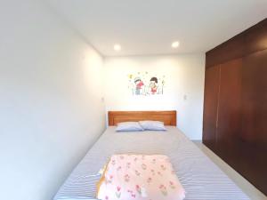 Ein Bett oder Betten in einem Zimmer der Unterkunft KENPI Homestay