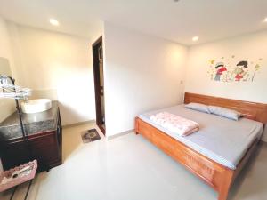 Ein Bett oder Betten in einem Zimmer der Unterkunft KENPI Homestay