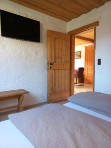Rúm í herbergi á Scheffauerhof