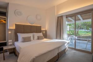 Postel nebo postele na pokoji v ubytování AMASEA Resort