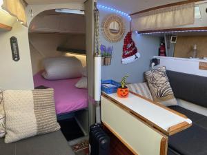 an interior view of an rv with a christmas hat on at nuit insolite sur un petit voilier in La Rochelle