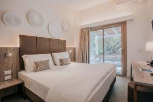 Postel nebo postele na pokoji v ubytování AMASEA Resort