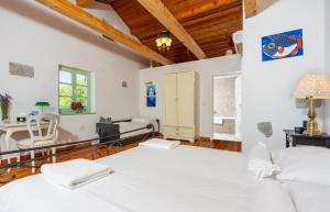 a bedroom with a bed and a living room at Villa Tribalj in Tribalj
