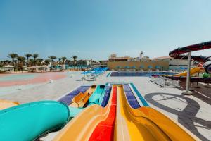 a pool with a colorful slide at a water park at Pickalbatros Dana Beach Resort - Aqua Park in Hurghada