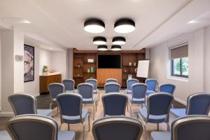 a conference room with chairs and a podium at Courtyard by Marriott Glasgow Airport in Paisley