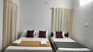 Guestland Homestay客房内的一张或多张床位