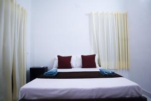 Guestland Homestay客房内的一张或多张床位
