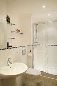 a bathroom with a sink and a toilet and a shower at Elizabeth Jennings Way in Oxford