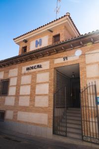 a building with a gate in front of it at Hostal Corper Navalcarnero in Navalcarnero