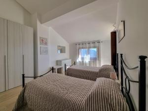 Postel nebo postele na pokoji v ubytování Villa Rosa