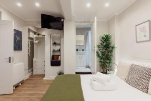 O bucătărie sau chicinetă la Kensington Nest Flat +21 fotografii