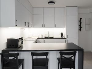 Kuchyňa alebo kuchynka v ubytovaní Apartament Smart Kamienica Grochów with free parking