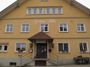 a yellow building with a sign that reads fabulous villa at Gasthaus Adler in Wangen im Allgäu