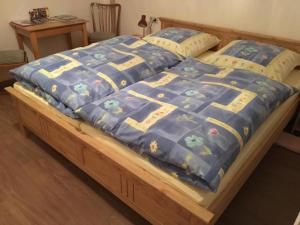מיטה או מיטות בחדר ב-Pension Alois Hennecke