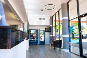 a store front with a lobby with glass doors at Howard Johnson by Wyndham Clearwater - Dunedin in Clearwater