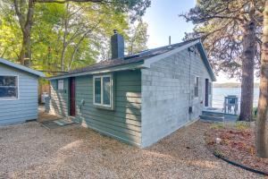 a tiny house on the shore of a lake at Quiet Plymouth Cottage on Great South Pond! in Plymouth