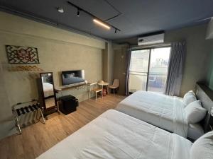隆廊民宿客房内的一张或多张床位