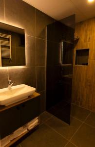 a bathroom with a sink and a shower at GRAND İŞBİLİR HOTEL in Nevşehir